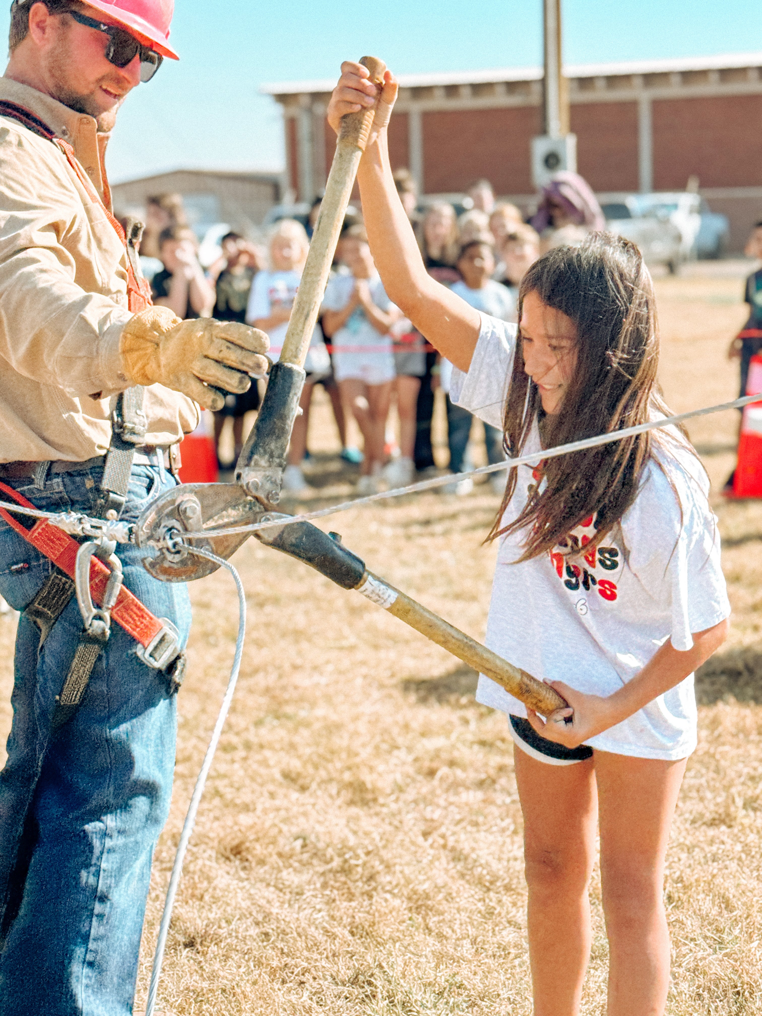 Landon with kid trying to cut wire